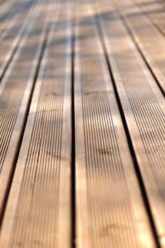 Wooden planks deck close-up perspective, natural background photo