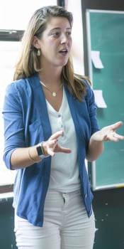 Young Woman Speaking During Class in Classroom photo