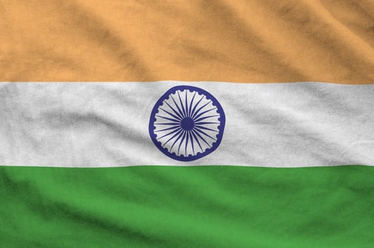 India flag depicted on folded wavy fabric of old cloth photo