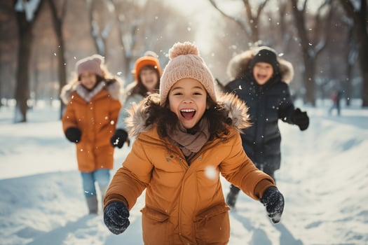 cheerful children playing winter games in a snowy park photo