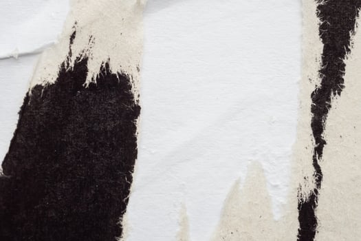 Old grunge ripped torn black paper poster surface texture background photo