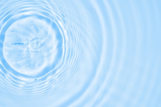 Abstract transparent water shadow surface texture natural ripple on blue background photo