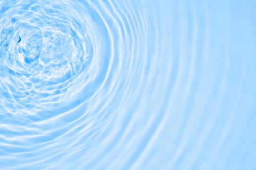 Abstract transparent water shadow surface texture natural ripple on blue background photo