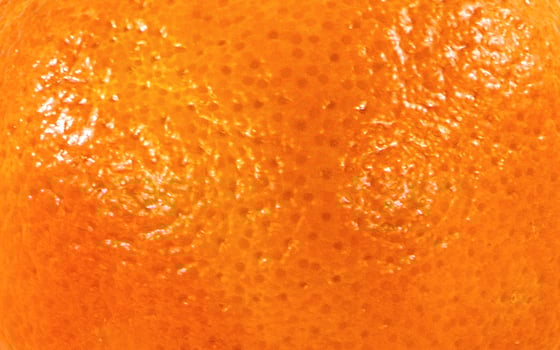 Yellow orange peel texture background. Good for fruit advertising design project photo