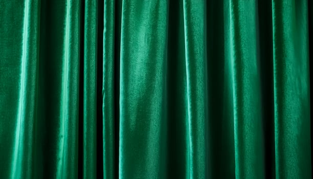 captures the luxurious texture of velvet curtains in a green hue, creating a soothing and elegant abstract background photo