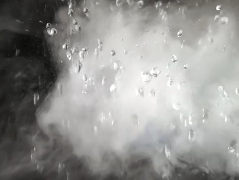 An Abstract Image of white steam with water droplets as background. photo