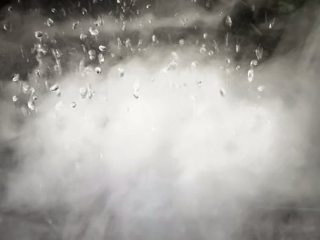 An Abstract Image of white steam with water droplets as background. photo