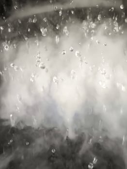 An Abstract Image of white steam with water droplets as background. photo