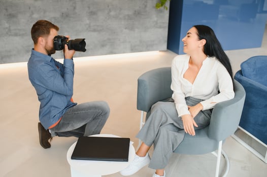 Young beautiful model posing for professional photographer in studio. photo