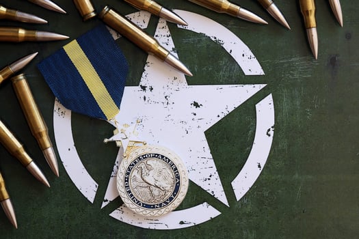 KYIV, UKRAINE - JULY 10, 2024 US Navy Distinguished Service medal. United States military award medal with ribbon and pin. Handmade paper theater props photo