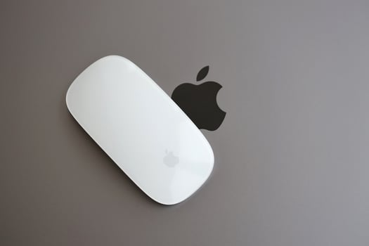 KYIV, UKRAINE - NOVEMBER 27, 2023 Apple Magic Mouse 3rd generation lies with grey MacBook 2021 photo