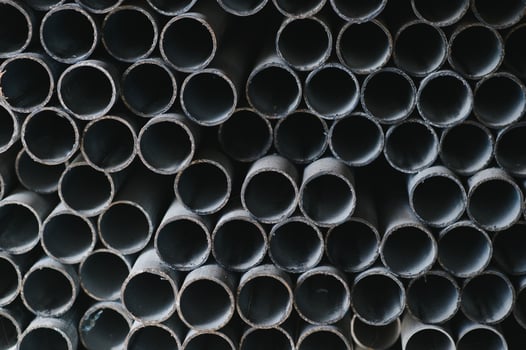 Stack of rolled metal products, perspective view of steel pipes of rectangular cross-section photo