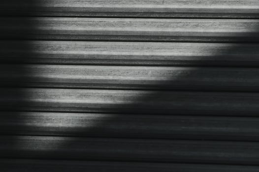 Stack of rolled metal products, perspective view of steel pipes of rectangular cross-section photo