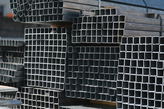 Aluminium profile for windows and doors manufacturing. Structural metal aluminium shapes. Aluminium profiles texture. Aluminium constructions factory photo