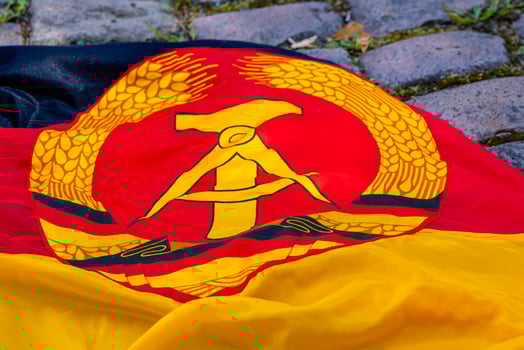 an old gdr flag with hammer and compass photo
