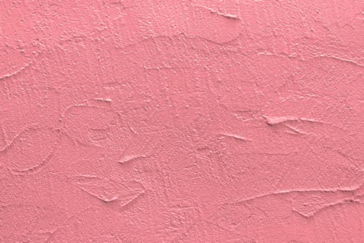 Pink stucco texture. Architectural abstract background. Pink wall of building. photo
