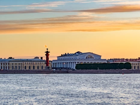 Stunning silhouette of St. Petersburg's skyline at sunset, featuring the Peter and Paul Fortress and other historic landmarks against a vibrant sky photo