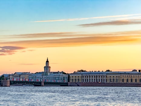 Stunning silhouette of St. Petersburg's skyline at sunset, featuring the Peter and Paul Fortress and other historic landmarks against a vibrant sky photo