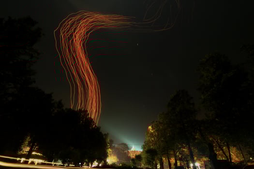 A Red Light Streaks In The Sky On Borobudur Temple photo