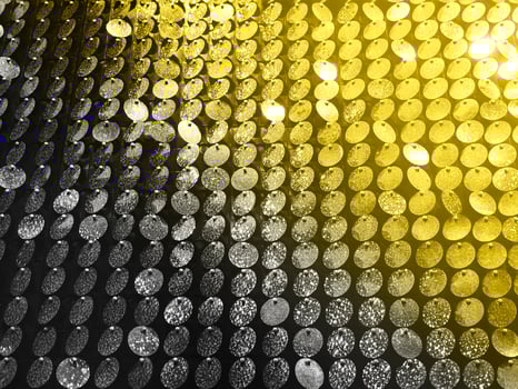 Colorful background of glowing sequins photo