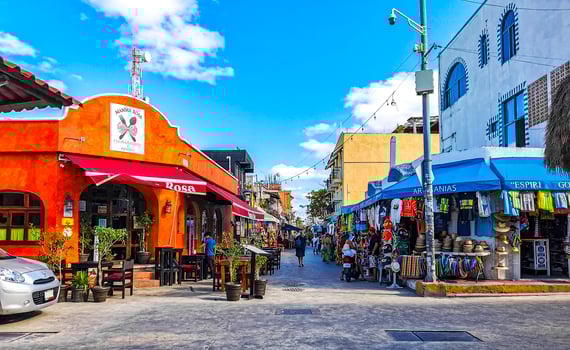 Typical colorful tourist streets sidewalks restaurants stores Isla Mujeres Mexico. photo