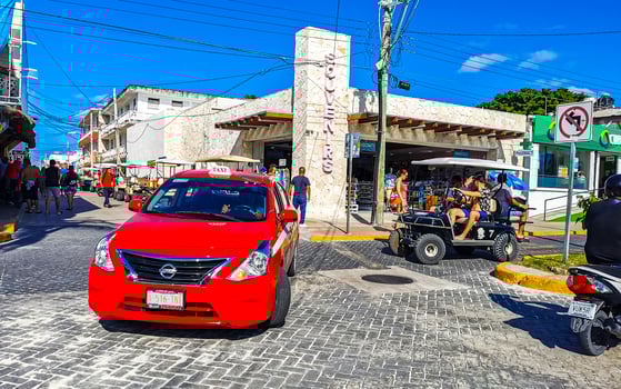 Gold cart rent drive tourist streets sidewalks Isla Mujeres Mexico. photo