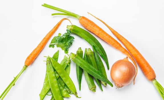 a bunch of vegetables arranged in a heart shape photo