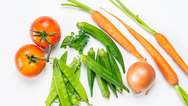 a variety of vegetables including carrots, beans, and tomatoes photo