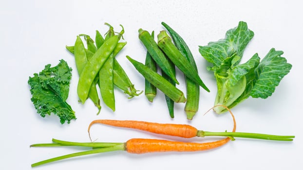 a bunch of vegetables on a white surface photo