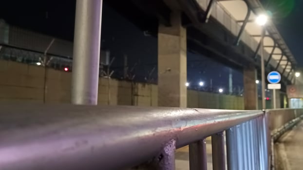 Iron handrail on the side of the road in Jakarta photo