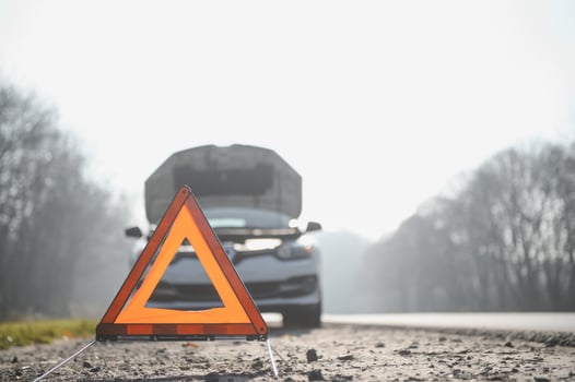 Broken car concept, breakdown triangle on road photo