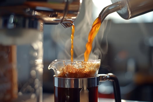 Coffee Maker Pouring Coffee into a Glass Background photo