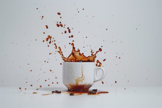 Coffee Splash, Coffee Cup, and Grounds on White Background photo