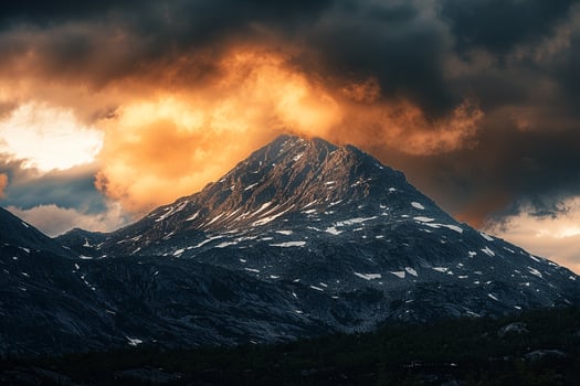 a mountain with clouds background photo