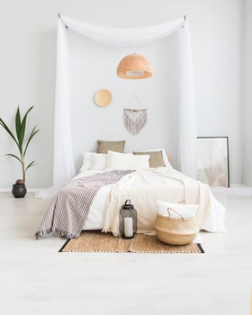 White and beige bedroom in boho style photo