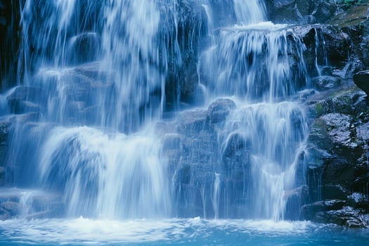 water flowing down a waterfall background photo
