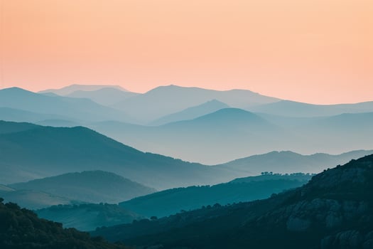 a view of the mountains at sunset background photo