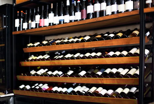 Bottles of wine on the shelves in a rack photo