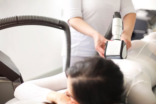 Crop woman having lipomassage in salon photo