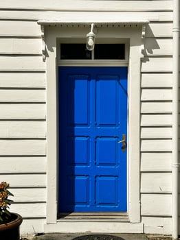 A front entrance of a home with a blue door, Blue front door wit photo