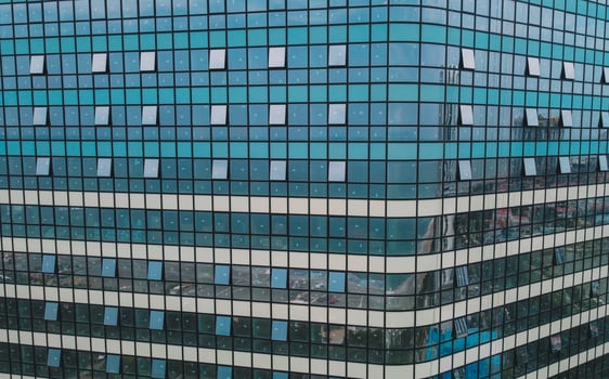 Modern High-Rise Building. Glass Skyscraper Aerial. Reflective Glass Skyscraper. photo