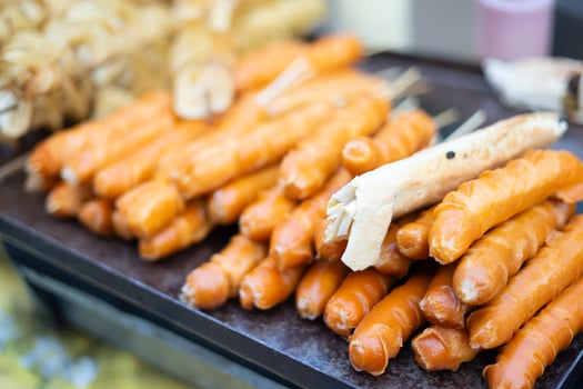 Grilled sausages sizzling on the barbecue, showcasing a delicious and savory treat perfect for outdoor gatherings photo