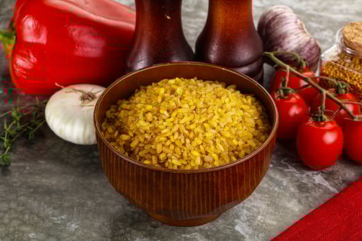 Dry wheat bulgur cereal heap photo