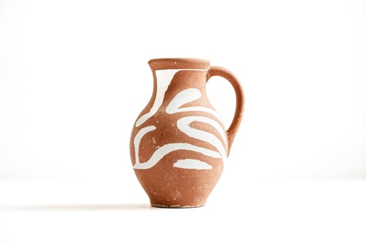 Clay Jug with White Design photo
