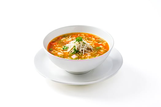 Bowl of soup with noodles and vegetables photo