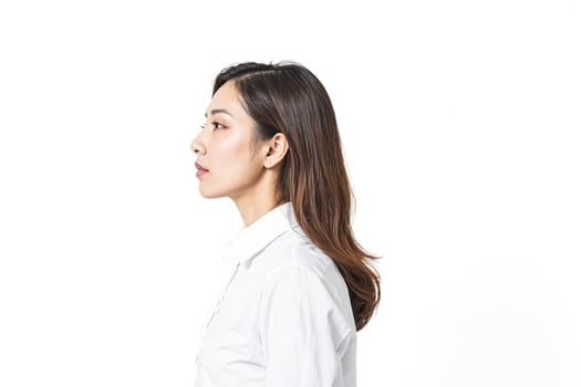 Young woman looking away, white background photo