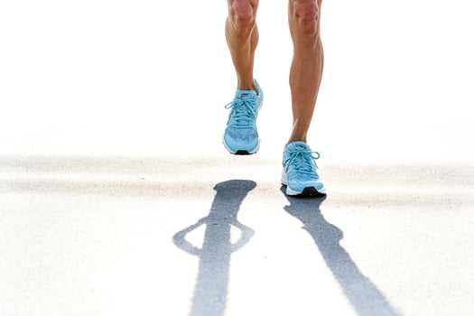 Runner's Legs and Shoes in Motion photo
