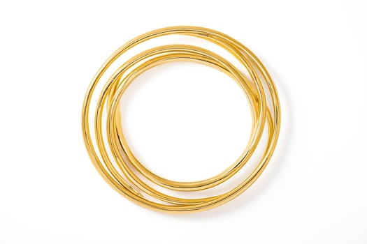 Gold Circle Rings on White Background photo