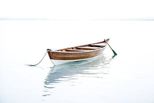 Wooden Rowboat on Still Water photo