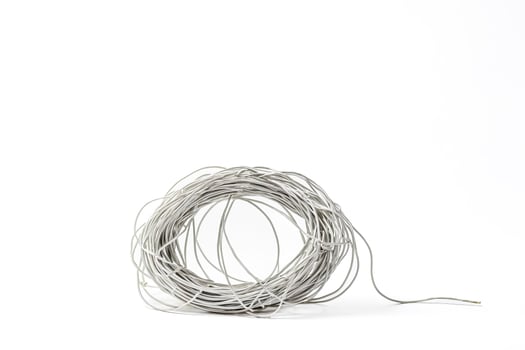 White Electrical Cable Coil On White Background photo